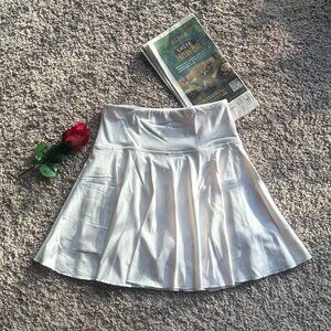 DRYFIT White Pleated Skirt – Size M (New) Condition: New without tags (NWOT).